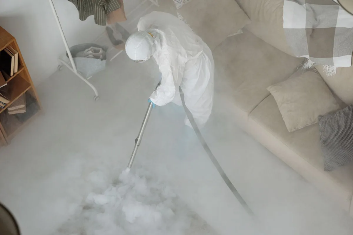 Biohazard cleanup technician in protective equipment, Mantorville, MN